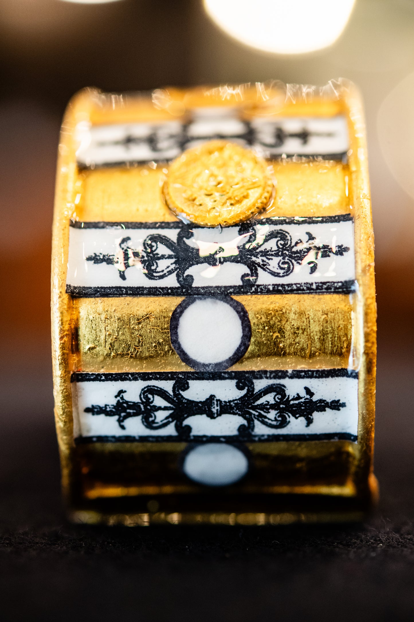 Gold, Black, and White Striped Intaglio Cuff Bracelet